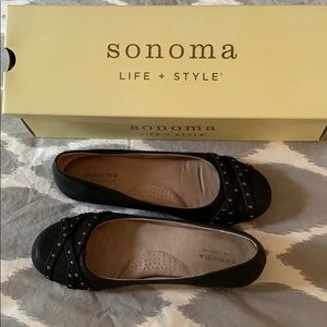 Black flats with stud embellishment